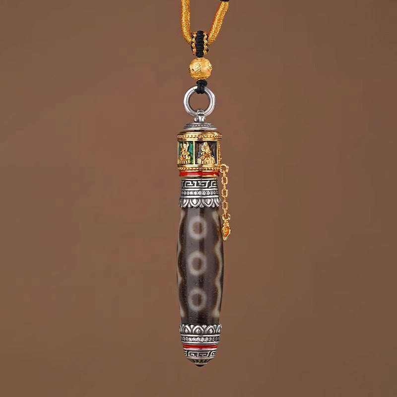 Tibetan dzi amulet necklace with rotating prayer wheel pendant and gemstone setting