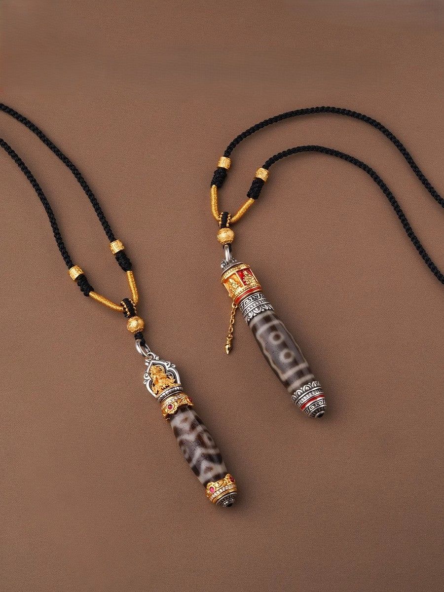 Pair of dzi bead necklaces with black cords and golden 
